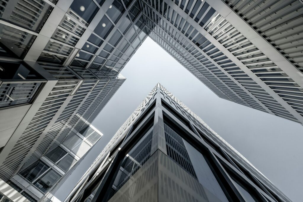 looking up at tall buildings in a city